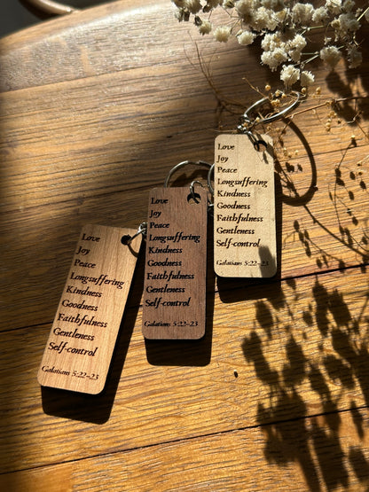 Keychain with three tags on a wooden surface
