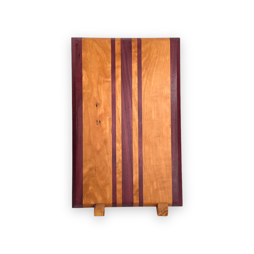 Cherry and Purple Heart - Handmade Wood Cutting Board - RTS fromt view on display stand
