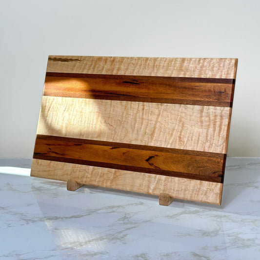 Exotic Fancy Maple - Handmade Wooden Cutting Board - RTS front view on display stands