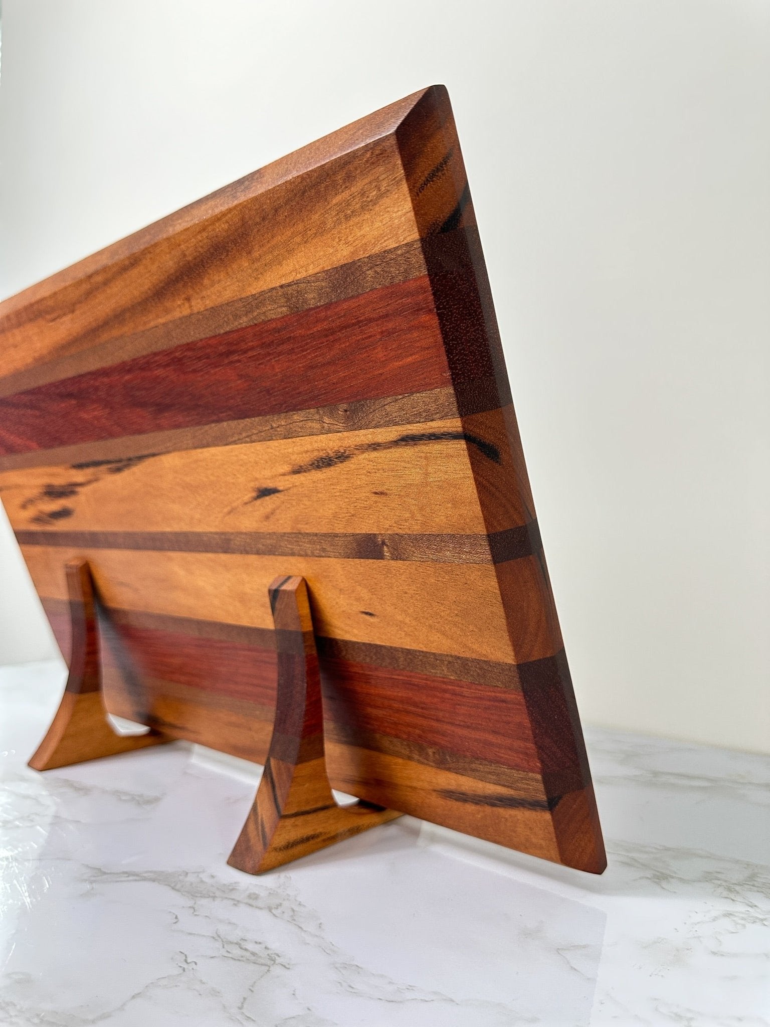 https://cornerstonewoodcraft.com/cdn/shop/products/exotic-tigerwood-handmade-wooden-cutting-board-rts-551124.jpg?v=1692233412&width=1946